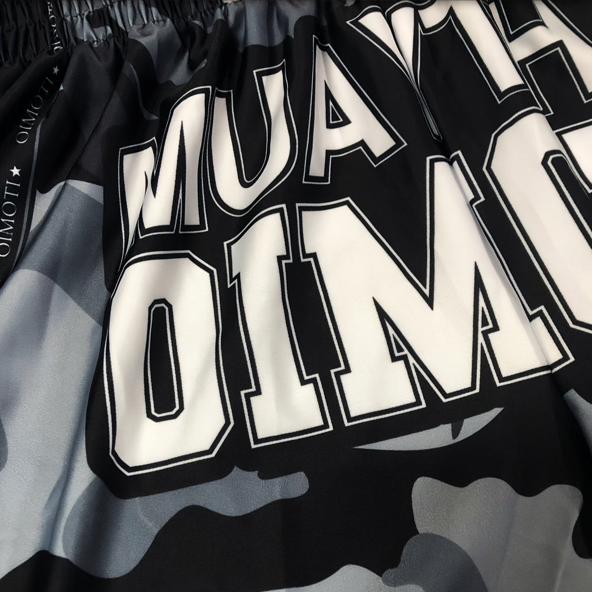 Short muay thai OIMOTI Pen Chang-Noir/Gris Nakmuay